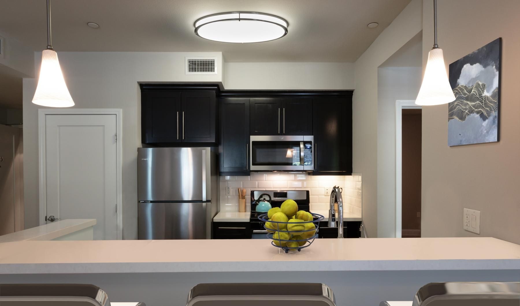 a kitchen with a bowl of fruit